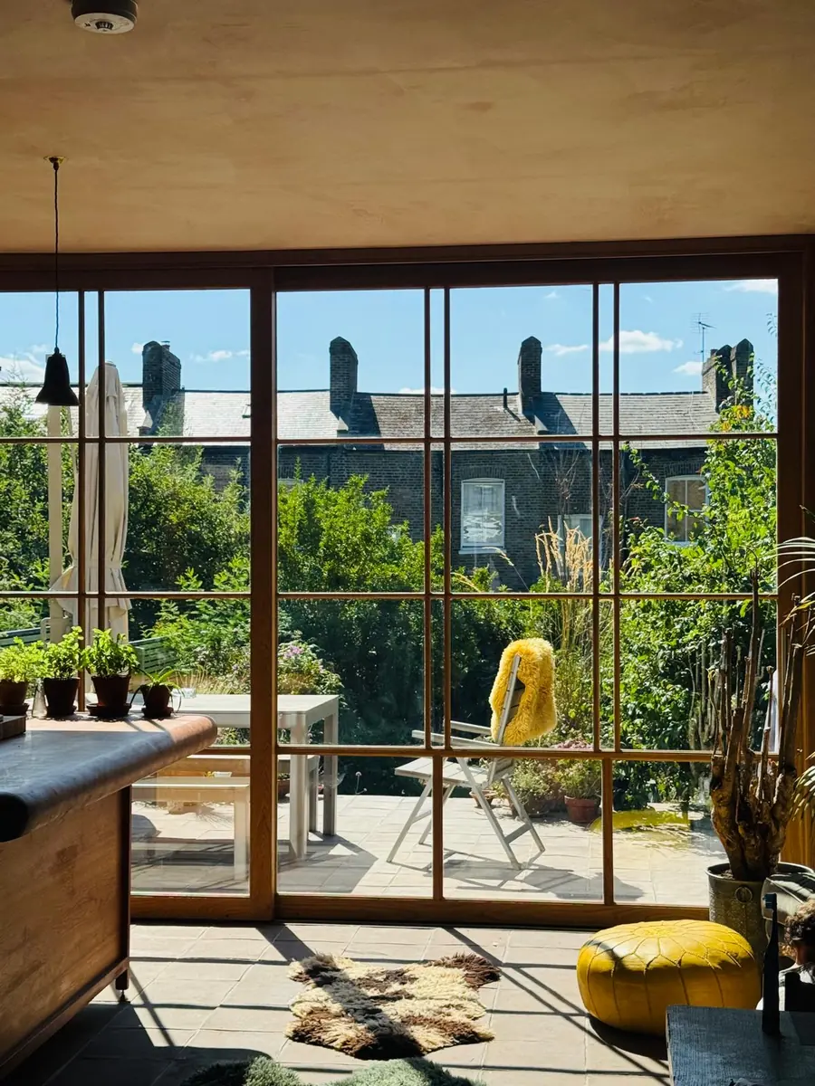 Bespoke oak sliding doors in Islington, North London — full-height glazed screen