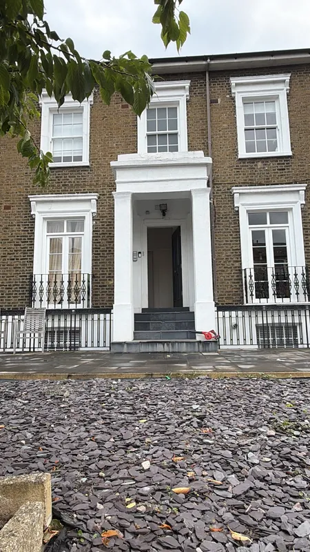 Completed front elevation with new Accoya timber windows and French doors, London