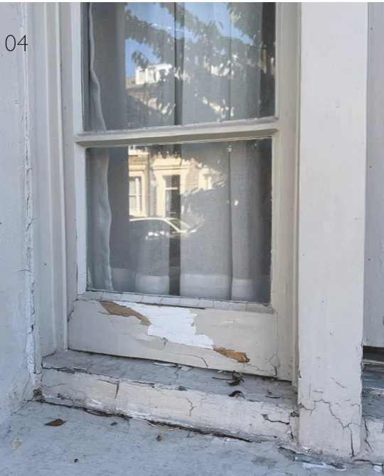 Decayed timber sill on a listed building sash window before replacement