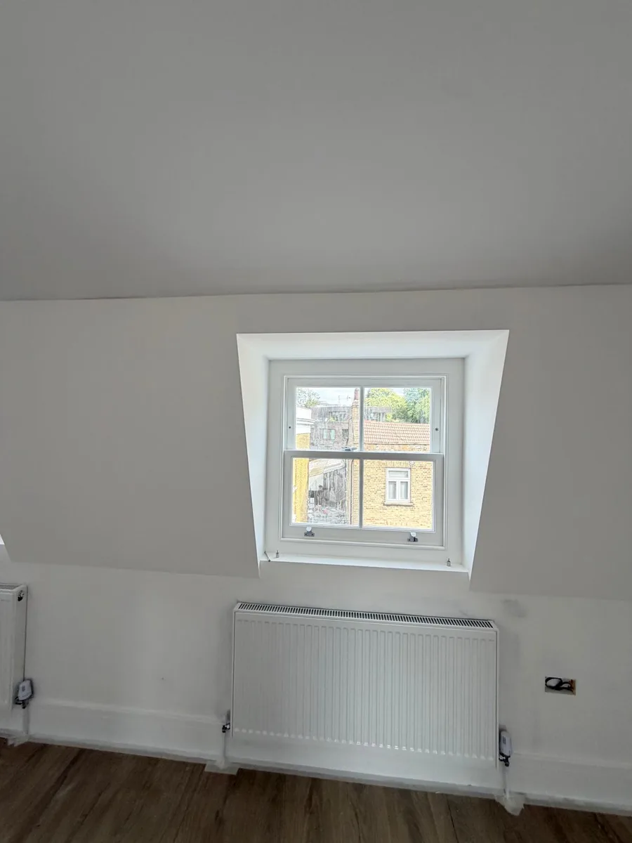 Heritage glass dormer sash window in a Hackney mansard roof