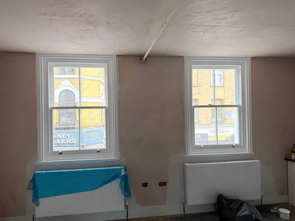 Pair of heritage glass sash windows fitted in a Hackney flat during refurbishment