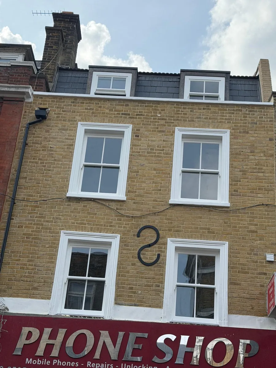 Heritage glass sash windows on a Hackney building — finished front elevation