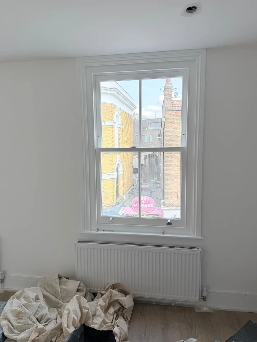 Finished flat with heritage glass sash window in Hackney