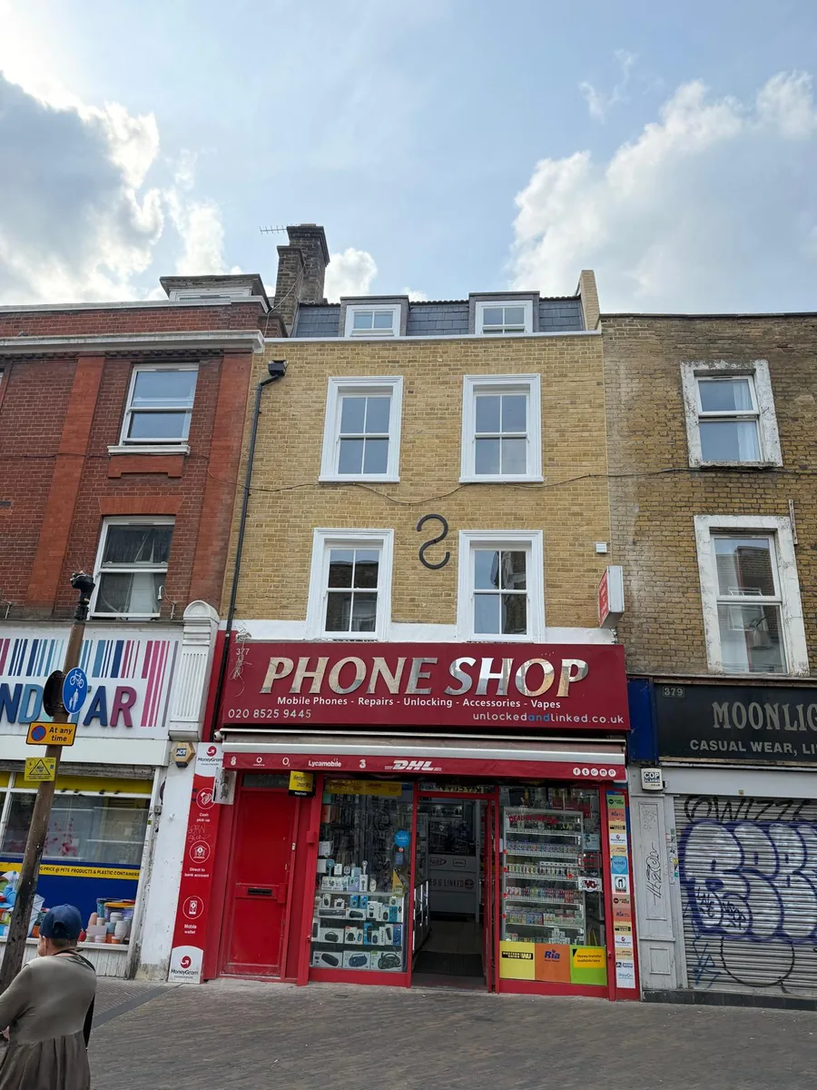 Completed heritage glass sash windows seen from the street in Hackney, London