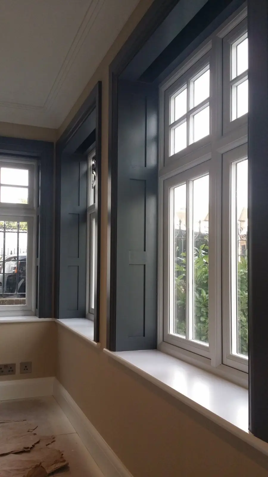 Brand new timber sash windows and integrated shutters installation in a residential home
