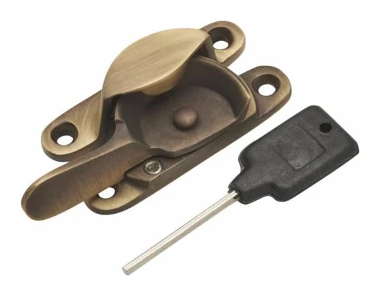 Antique brass Fitch sash fastener with key