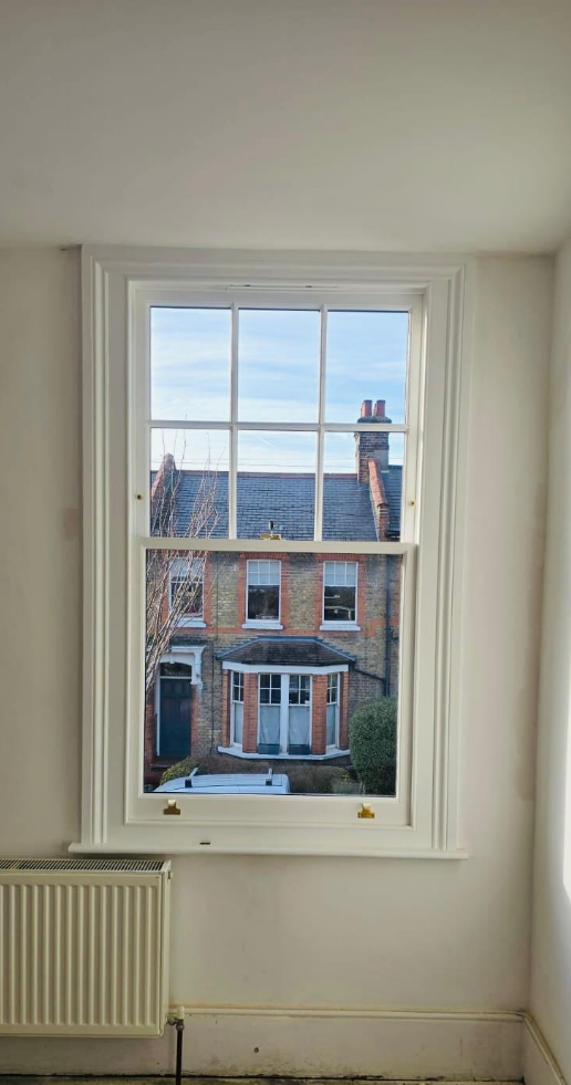Victorian sash window restoration with traditional glazing bars in Stoke Newington London
