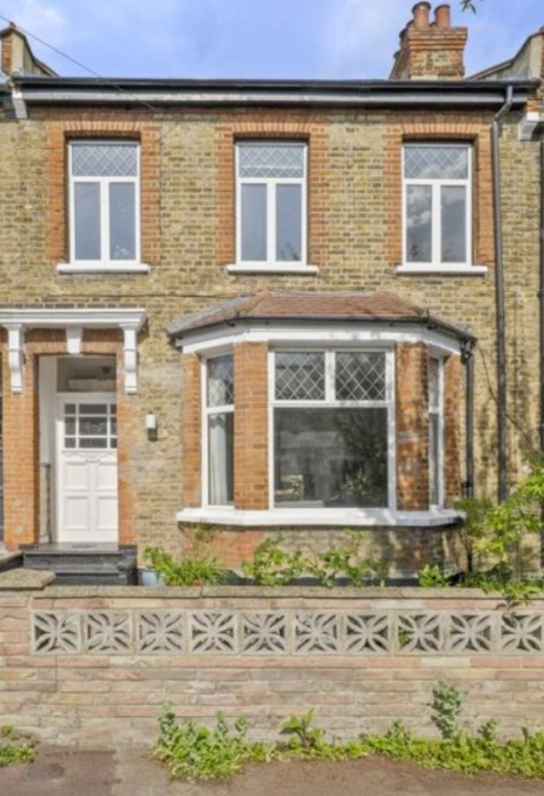 Victorian terraced house in Stoke Newington with original PVC windows before sash window restoration