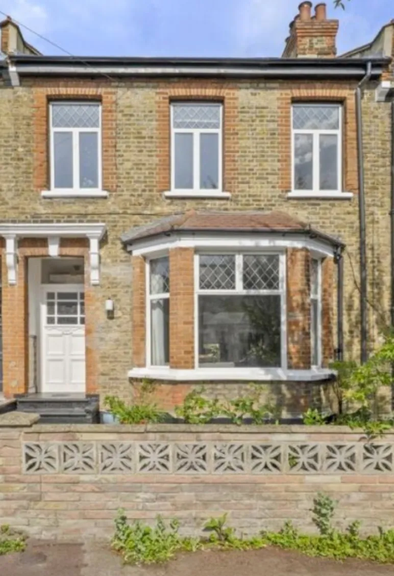 Victorian terraced house in Stoke Newington with original PVC windows before sash window restoration